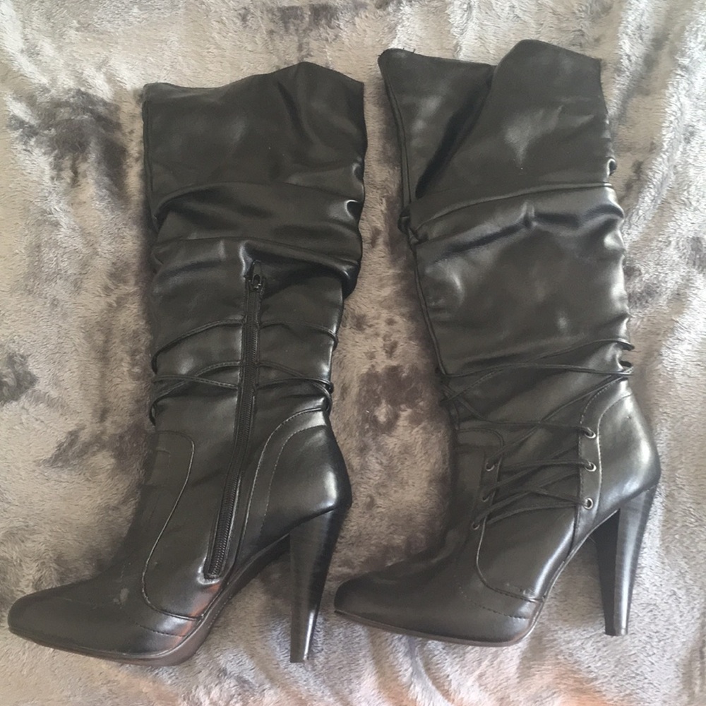 Knee high black heeled boots